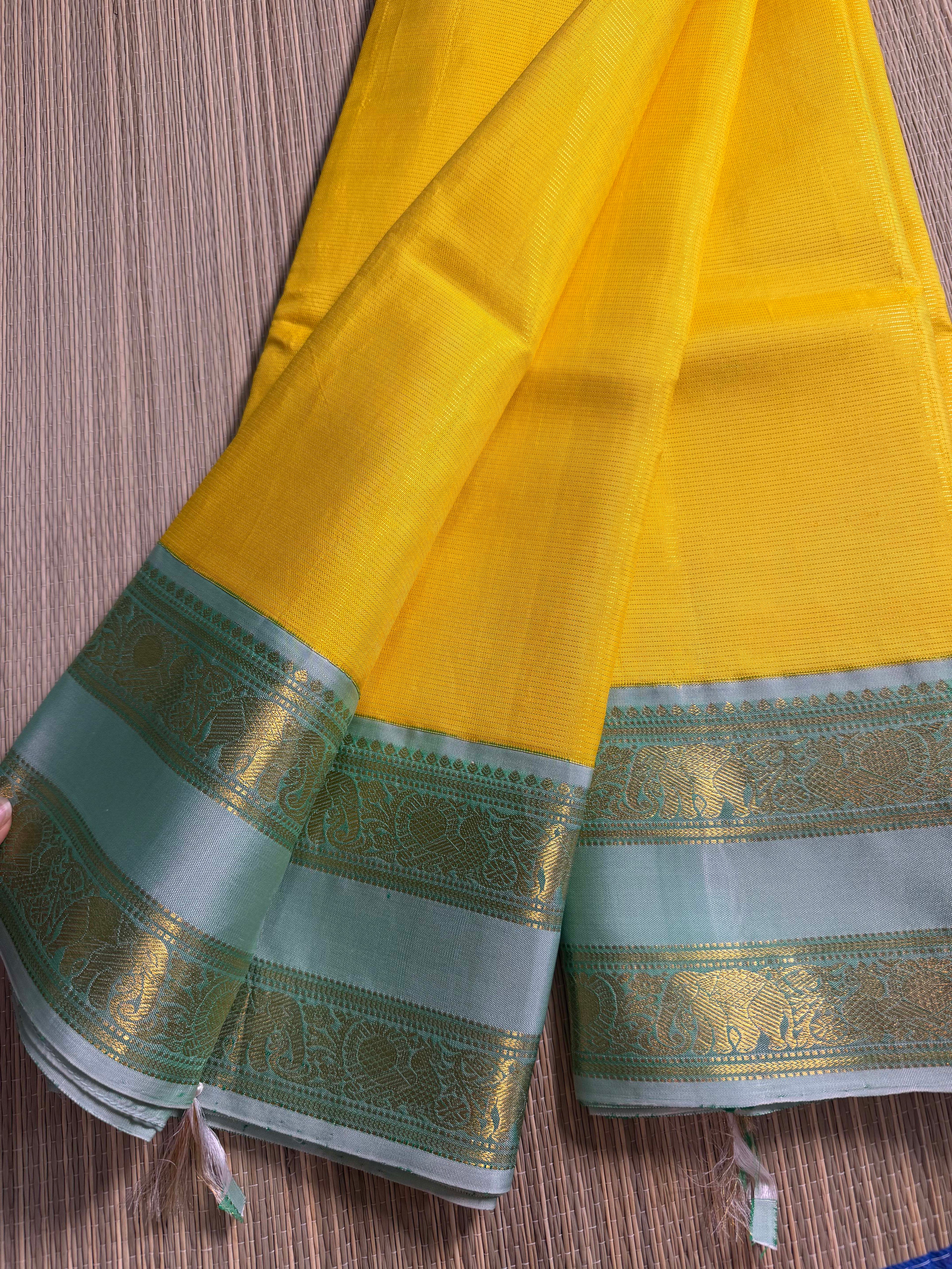 Yellow Kanchipuram Silk Saree with Mint Green Zari Border